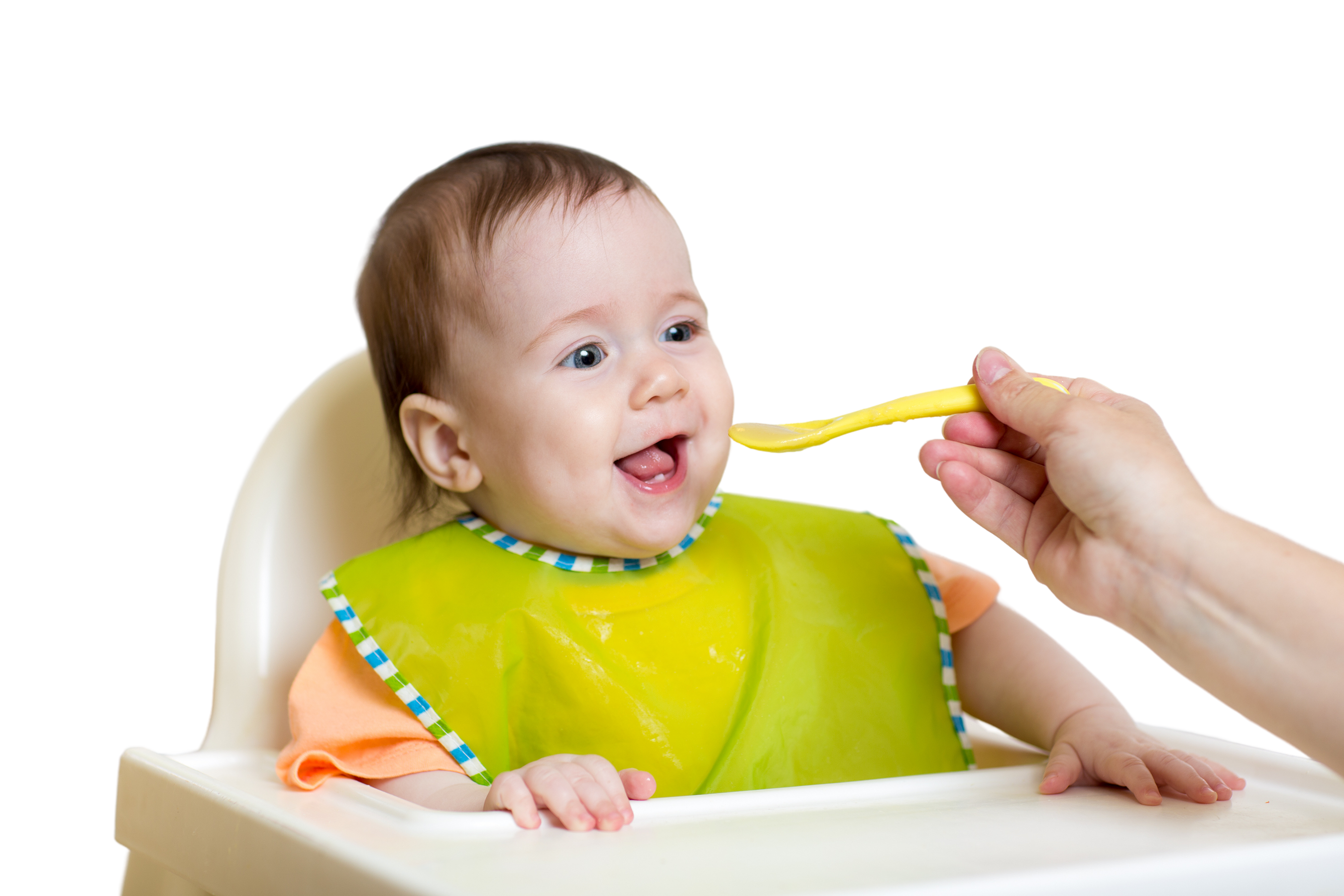 baby eating food on kitchen
